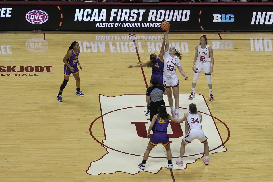 Tennessee Tech's Anna Walker (4) and Indiana's Lilly Meister (52) tip-off for the start during of a first-round college basketball game in the women's NCAA Tournament Saturday, March 18, 2023, in Bloomington, Ind. (AP Photo/Darron Cummings)