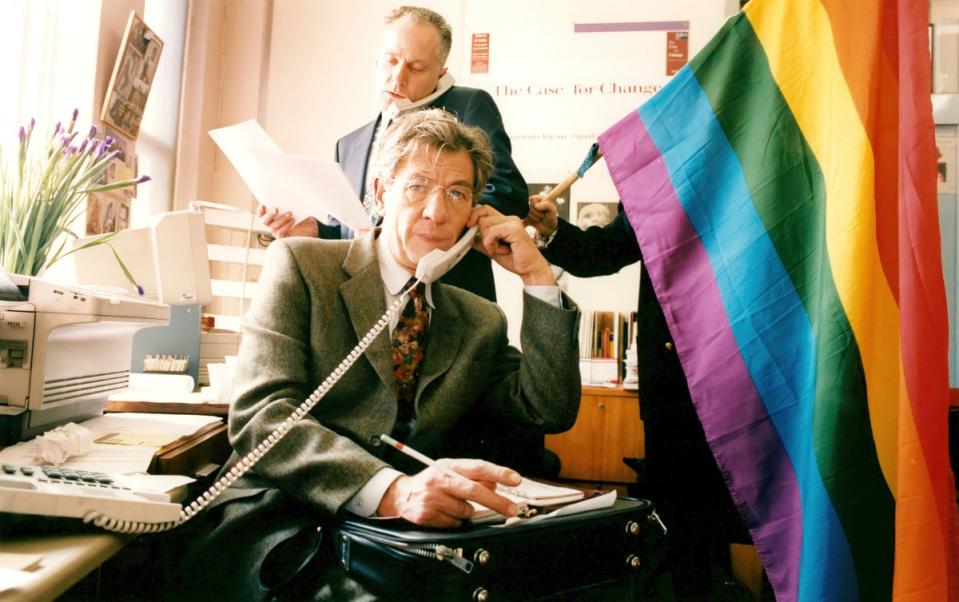 Sir Ian McKellen on the phone at Stonewall offices before the government’s age of consent reform in 1994. To buy this print, click here (Philip Meech/The Independent)