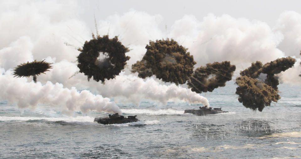 South Korean marine LVT-7 landing craft sail to shores through smoke screens during the U.S.-South Korea joint military exercises called Ssangyong, part of the Foal Eagle military exercises, in Pohang, South Korea, Monday, March 31, 2014. (AP Photo/Ahn Young-joon)