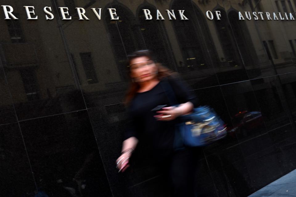 A pedestrian walks past the Reserve Bank of Australia building in Sydney on November 3, 2020. (Photo by Saeed KHAN / AFP) (Photo by SAEED KHAN/AFP via Getty Images)