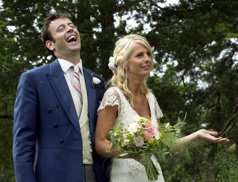 Ulrika Jonsson, right, and her British husband Lance Gerrard-Wright are seen during a photo call right after their wedding on the island of Varmdo in the Stockholm archipelago, Sweden, Saturday Aug.16 2003.  (AP Photo /Pressens Bild/Mark Earthy)  ** SWEDEN OUT **