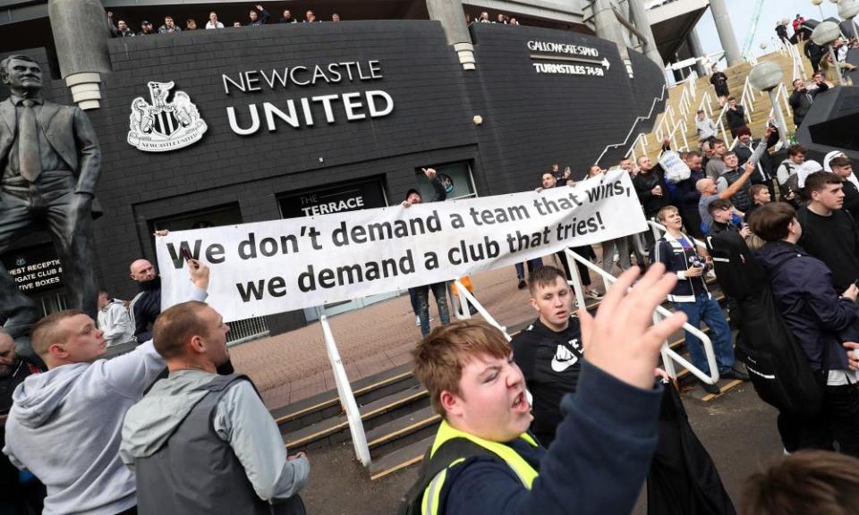 Newcastle United fans outside St James’ Park try to get their point across