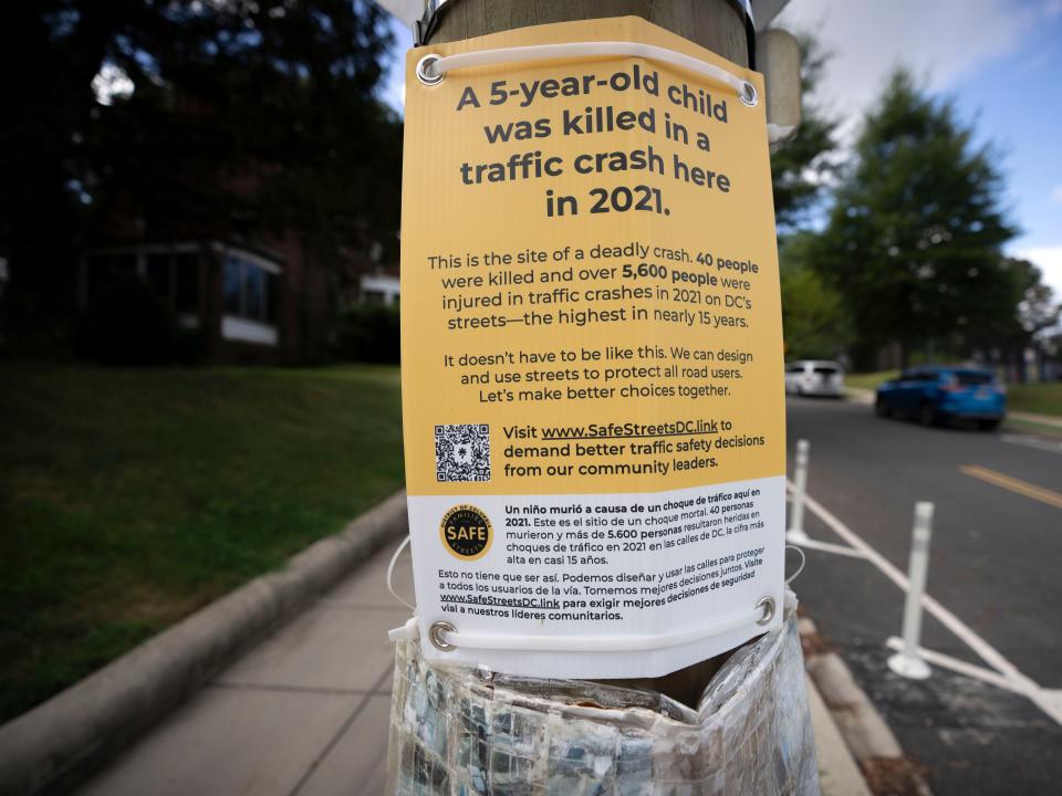 A sign on a post near Allie Hart's memorial that supports Families for Safe Streets.