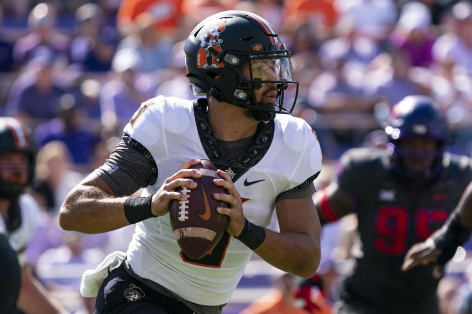 Oklahoma State quarterback Spencer Sanders looks to pass against TCU on Oct. 15.