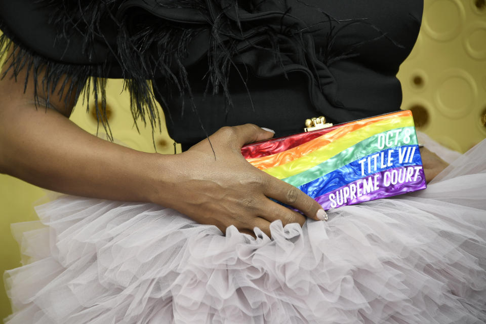 Laverne Cox brought a rainbow-striped Edie Parker clutch to the 2019 Emmy Awards that reminded Americans about an upcoming Supreme Court case with major implications for LGBTQ workers.  (Photo: Frazer Harrison via Getty Images)