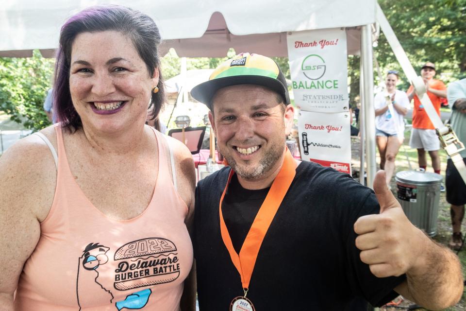 John Berl, owner of Uncle John's BBQ located on Philadelphia Pike in Holly Oak, with Delaware Burger Battle organizer JulieAnne Cross at Rockford Park last summer. His restaurant regularly uses the Delaware takeout Facebook group to spread the word about its menu items,.