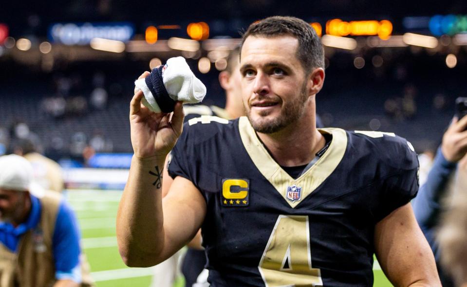 Sep 8, 2024; New Orleans, Louisiana, USA; New Orleans Saints quarterback Derek Carr (4) tosses his towel to a fan before heading to the locker room after the game against the Carolina Panthers at Caesars Superdome. Mandatory Credit: Stephen Lew-Imagn Images