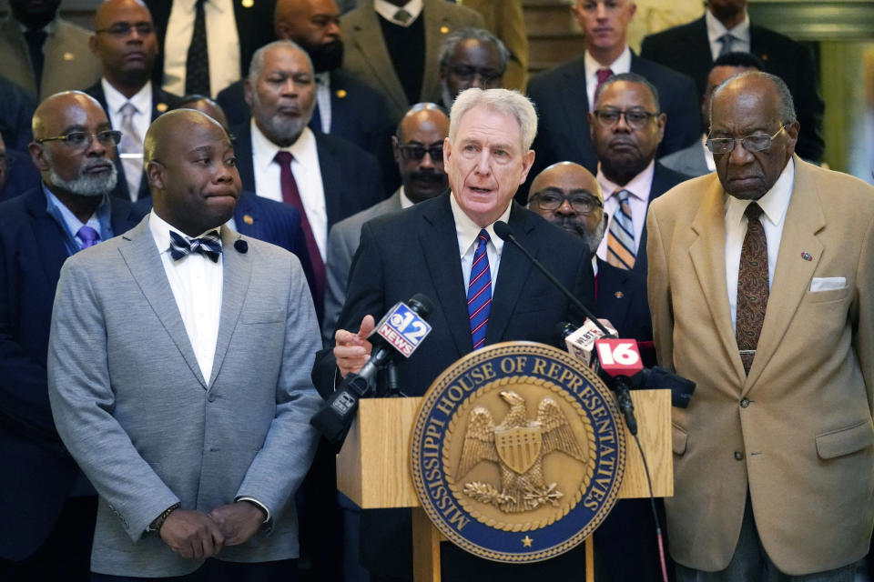 Dr. Dan Jones, the former chancellor of University of Mississippi, center, speaks at a news conference at the state Capitol in Jackson, where Democratic legislative leaders, criticized the Republican leadership's inaction on addressing the state's hospital crisis, Thursday, Feb. 2, 2023. Jones said Gov. Tate Reeves once privately acknowledged to him the benefits of Medicaid expansion, but publicly, the governor has long resisted expansion. (AP Photo/Rogelio V. Solis)