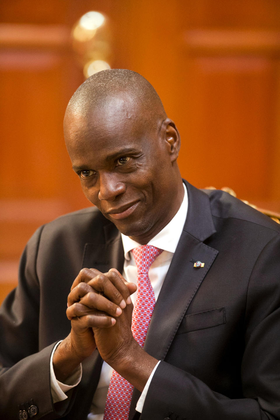 Haiti's President Jovenel Moise speaks during an interview at his home in Petion-Ville, a suburb of Port-au-Prince, Haiti, Friday, Feb. 7, 2020. Moise is a former banana farmer who won 56 percent of the vote against three opponents in 2016 elections. He made some progress on rural infrastructure projects during his first two years in office. Then the end of subsidized Venezuelan oil aid to Haiti fueled chaos in the western hemisphere's poorest nation. (AP Photo/Dieu Nalio Chery)