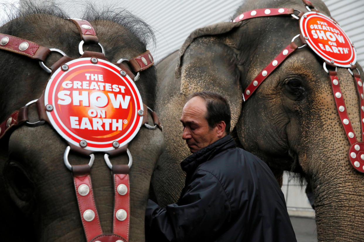 Senior Elephant Handler Alex Petrov interacts with the elephants after they appeared in their final show for the Ringling Bros and Barnum & Bailey Circus in Wilkes-Barre, Pennsylvania, U.S., May 1, 2016. REUTERS/Andrew Kelly 