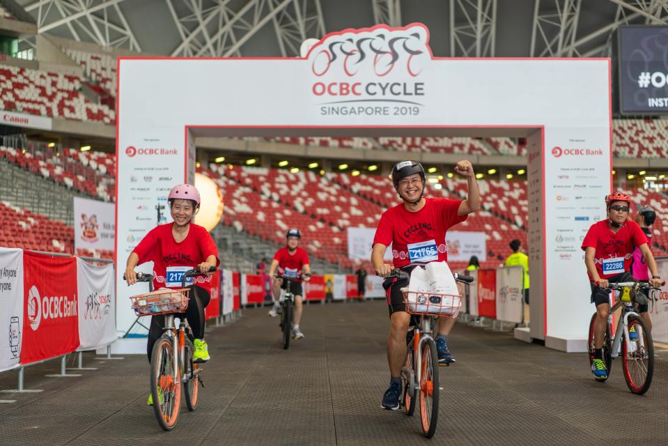 OCBC Cycle 2019 participants crossing the finish line at the National Stadium. (PHOTO: OCBC Cycle)