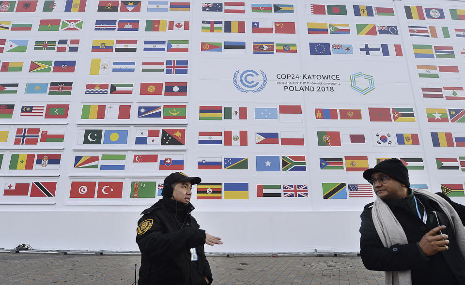 Guests arrive at the 'Spodek' multipurpose arena complex for the COP24 summit in Katowice , Poland, Wednesday, Dec. 5, 2018. (AP Photo/Czarek Sokolowski)