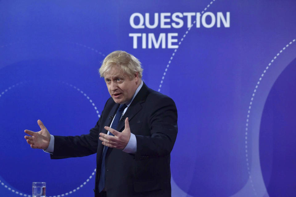 Britain's Prime Minister Boris Johnson gestures, during a BBC Question Time live election debate, in Sheffield, England, Friday, Nov. 22, 2019. ( Jeff Overs/BBC via AP)