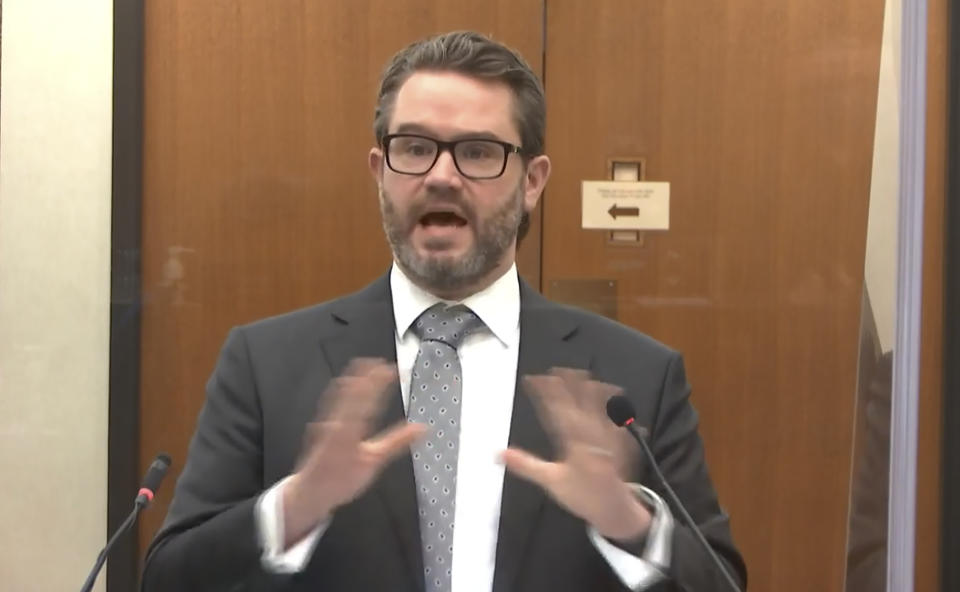 In this image from video, defense attorney Eric Nelson questions Minneapolis Police Officer Nicole Mackenzie as Hennepin County Judge Peter Cahill presides, Tuesday, April 13, 2021, in the trial of former Minneapolis police Officer Derek Chauvin at the Hennepin County Courthouse in Minneapolis, Minn. Chauvin is charged in the May 25, 2020 death of George Floyd. (Court TV via AP, Pool)