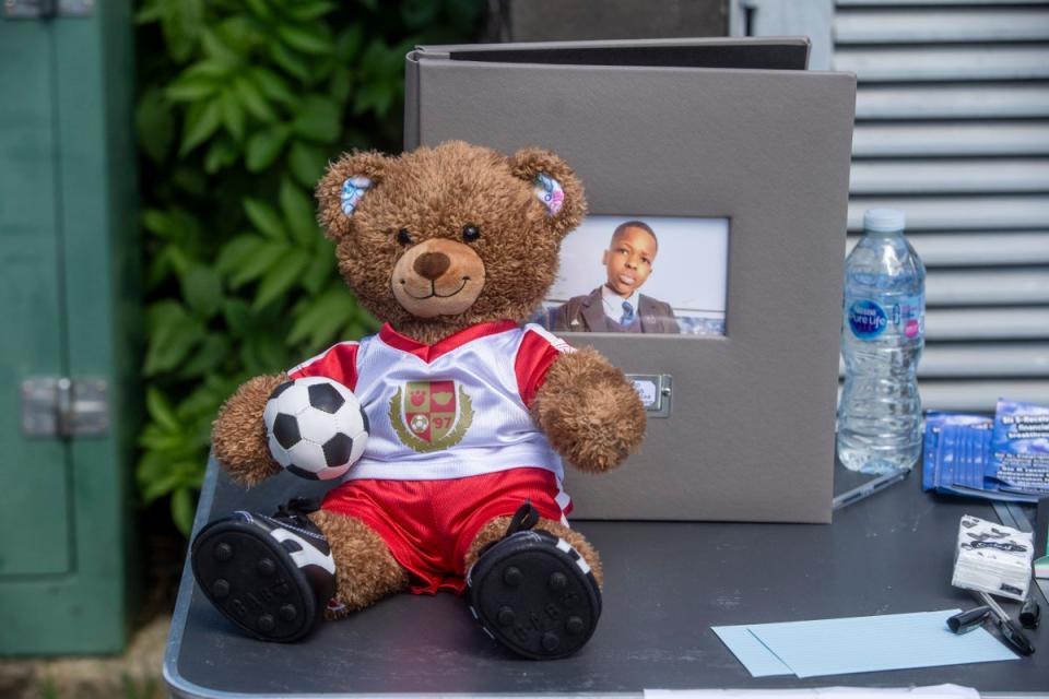 A teddy bear in an Arsenal shirt placed in memory of 14-year-old Daniel Anjorin (PA Wire)