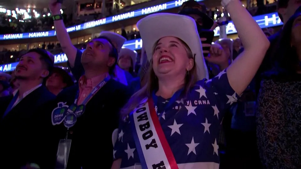 A Democratic National Convention attendee dons a Beyoncé-inspired sash that says "Cowboy Kamala"