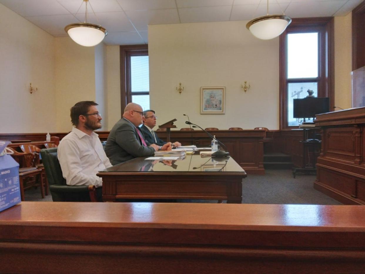 Dalbert W. "Dale" Sanders, left, listens during his sentencing hearing Tuesday in Tuscarawas County Common Pleas Court. Also shown are defense attorney John R. Watters, II, center, and County Prosecutor Ryan D. Styer.