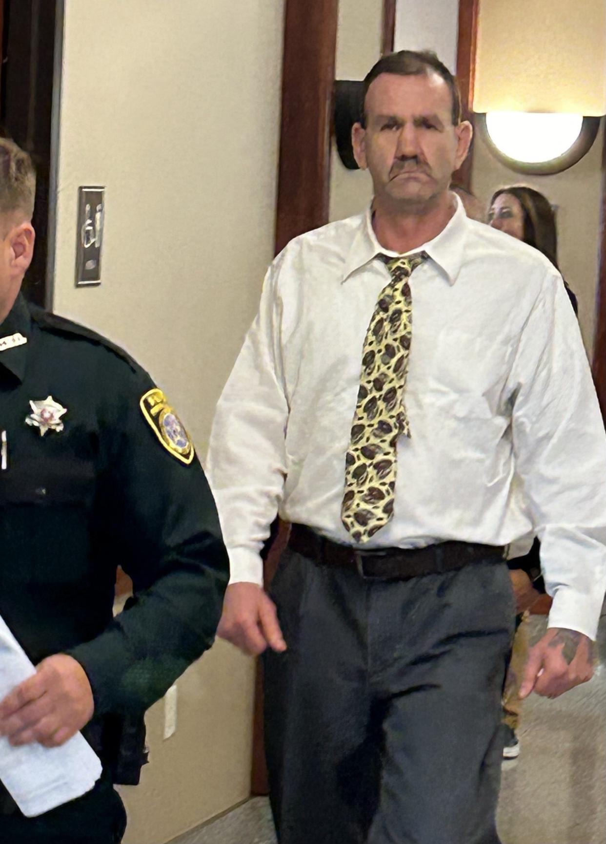 Murder defendant Larry Doil Sanders is escorted from the courtroom during a break Tuesday in his nonjury trial at the Pontotoc County Courthouse in Ada.