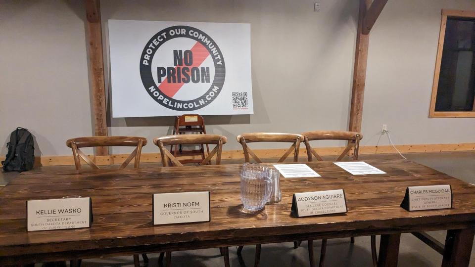 Place settings for Department of Corrections Secretary Kellie Wasko and Governor Kristi Noem at NOPE's second public forum Dec. 21, 2023, in Harrisburg, South Dakota.