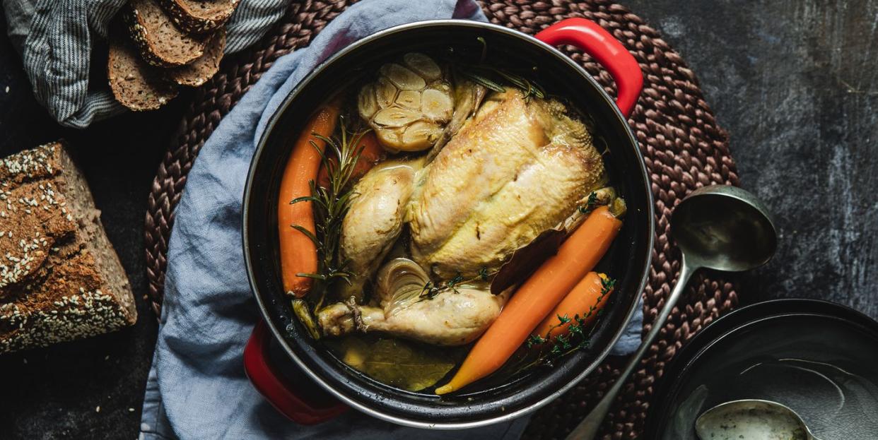 healthy chicken soup with organic vegetables and wholegrain bread