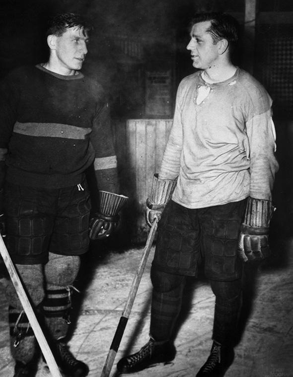 <p>1946: Milt Schmidt #15 and Dit Clapper #5 of the Boston Bruins talk on the ice circa 1946. (Photo by Bruce Bennett Studios/Getty Images) </p>