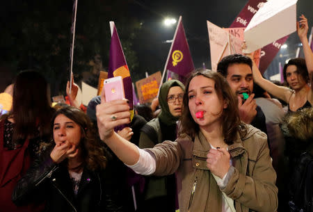 People react as police try to disperse a march marking International Women's Day in Istanbul, Turkey, March 8, 2019. REUTERS/Murad Sezer