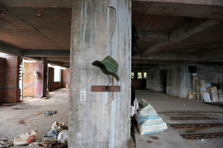 A hat is pictured in a suspended construction project in Yangon, Myanmar, July 21, 2016. Picture taken July 21, 2016. REUTERS/Soe Zeya Tun