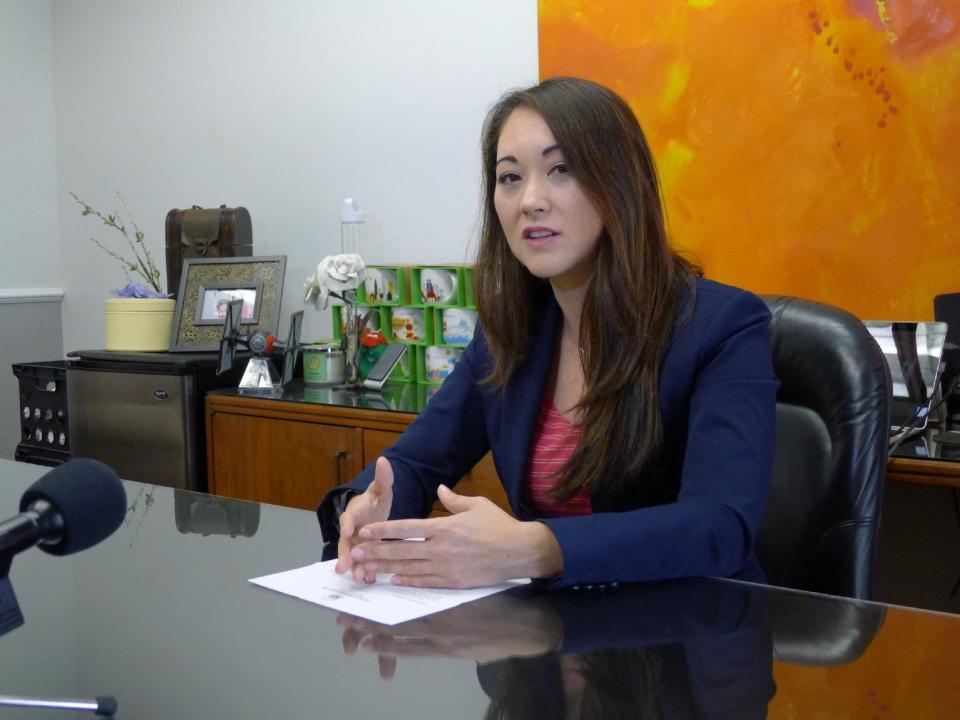 Rep. Beth Fukumoto talks with reporters in her capitol office on Wed., Feb. 1, 2017 in Honolulu. In deep-blue Hawaii, Fukumoto is considering switching parties to become a Democrat after she was pressured to resign her leadership role for criticizing President Donald Trump. (AP Photo/Cathy Bussewitz)