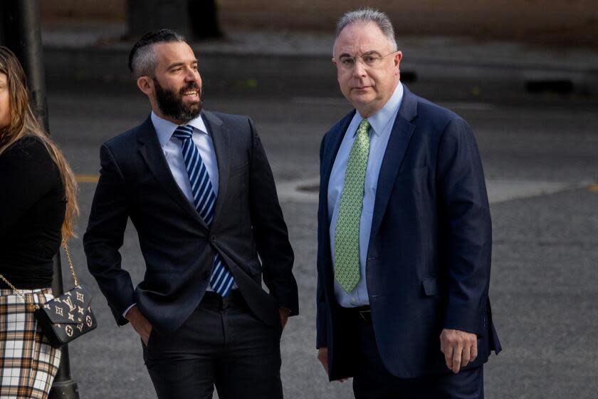 Los Angeles, CA - November 07: Paul Paradis, right, in green tie, a key government cooperator in the legal scandal involving the Department of Water and Power and the City Attorney's Office, arrives with his lawyer to be sentenced, at U.S. Federal Courthouse in downtown Los Angeles, CA, Tuesday, Nov. 7, 2023. (Jay L. Clendenin / Los Angeles Times)