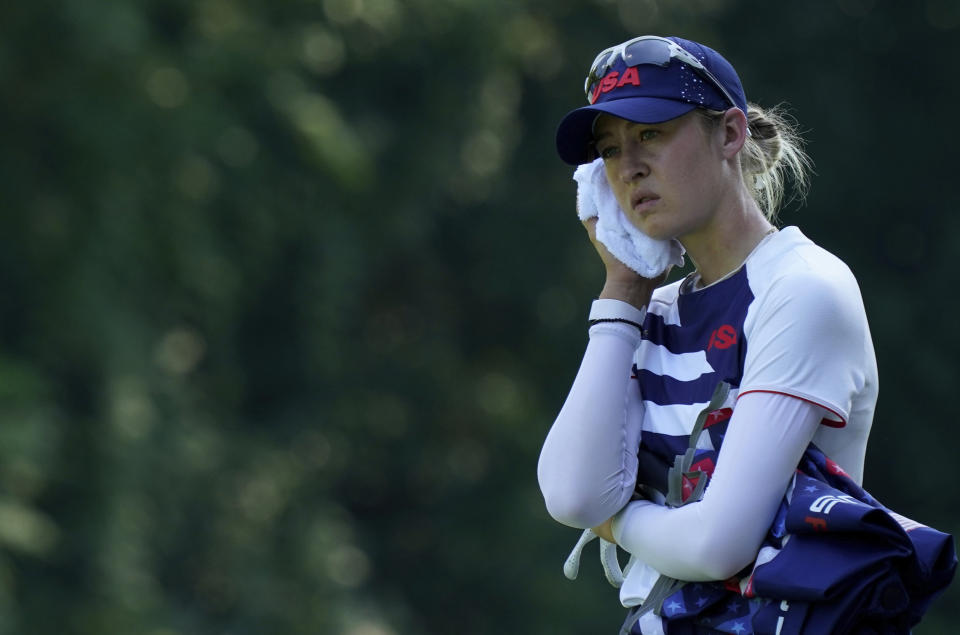 Nelly Korda, of the United States, refreshes on 14th hole during the second round of the women's golf event at the 2020 Summer Olympics, Thursday, Aug. 5, 2021, at the Kasumigaseki Country Club in Kawagoe, Japan. (AP Photo/Matt York)