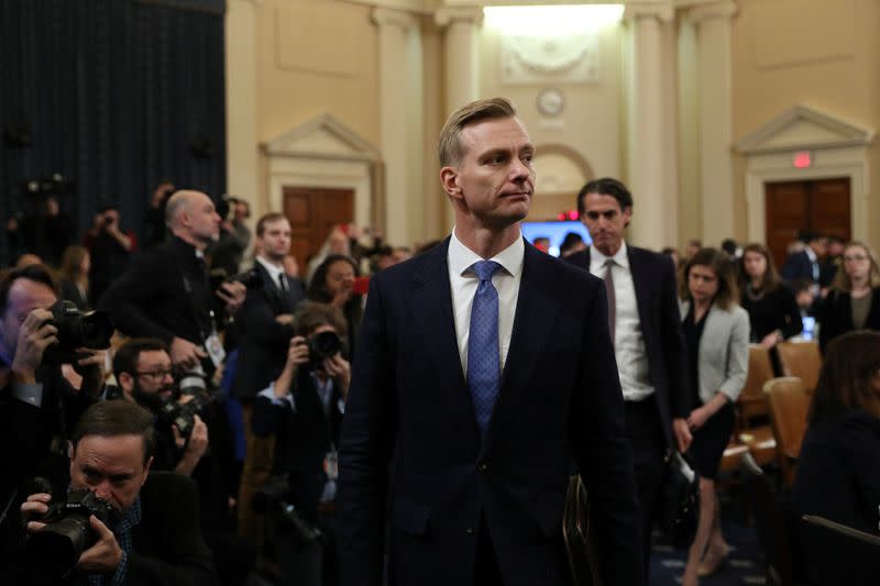 FILE PHOTO: David Holmes departs after testifying at a House Intelligence Committee hearing as part of the impeachment inquiry in Washington