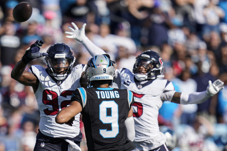 Carolina Panthers quarterback Bryce Young (9) passes under pressure from a Houston Texans defense during the second half of an NFL football game, Sunday, Oct. 29, 2023, in Charlotte, N.C. (AP Photo/Erik Verduzco)