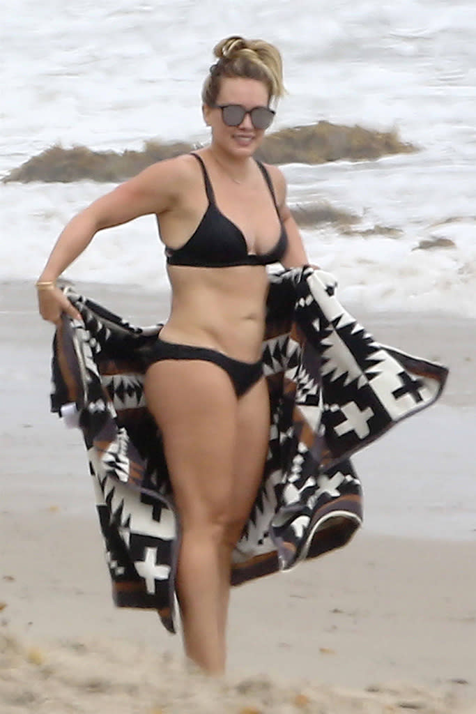 <p>The <em>Younger</em> star had a weekend with the exes! Not only was she snapped with her former husband, Mike Comrie (they took son Luca to the beach in Malibu, where she was snapped in this black bikini), but the <a rel="nofollow" href="https://www.yahoo.com/style/hilary-duff-tells-body-shaming-critics-kiss-swimsuit-photo-220851477.html" data-ylk="slk:vocal proponent of body positivity;elm:context_link;itc:0;sec:content-canvas;outcm:mb_qualified_link;_E:mb_qualified_link;ct:story;" class="link  yahoo-link">vocal proponent of body positivity</a> also flexed her muscles at the gym with her trainer ex-boyfriend Jason Walsh a day before. New(ish) <a rel="nofollow noopener" href="http://www.usmagazine.com/celebrity-news/pictures/hilary-duff-and-new-boyfriend-ely-sandvik-show-plenty-of-pda-w498673" target="_blank" data-ylk="slk:boyfriend Ely Sandvik;elm:context_link;itc:0;sec:content-canvas" class="link ">boyfriend Ely Sandvik</a> must not be lacking in confidence. (Photo: BACKGRID) </p>