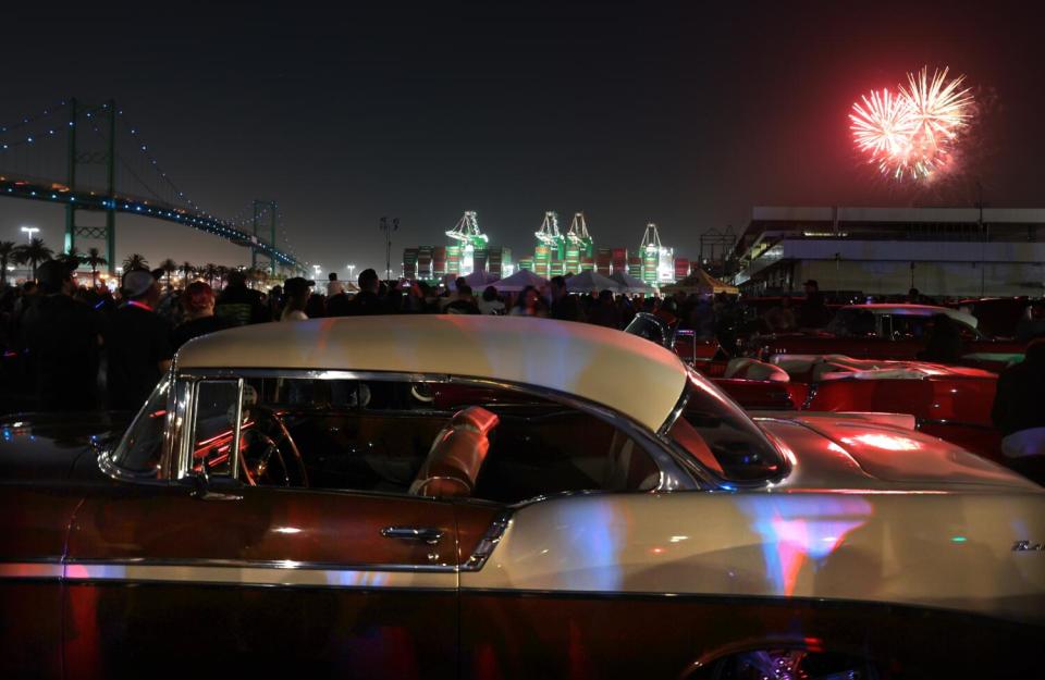 A firework in the sky over a car