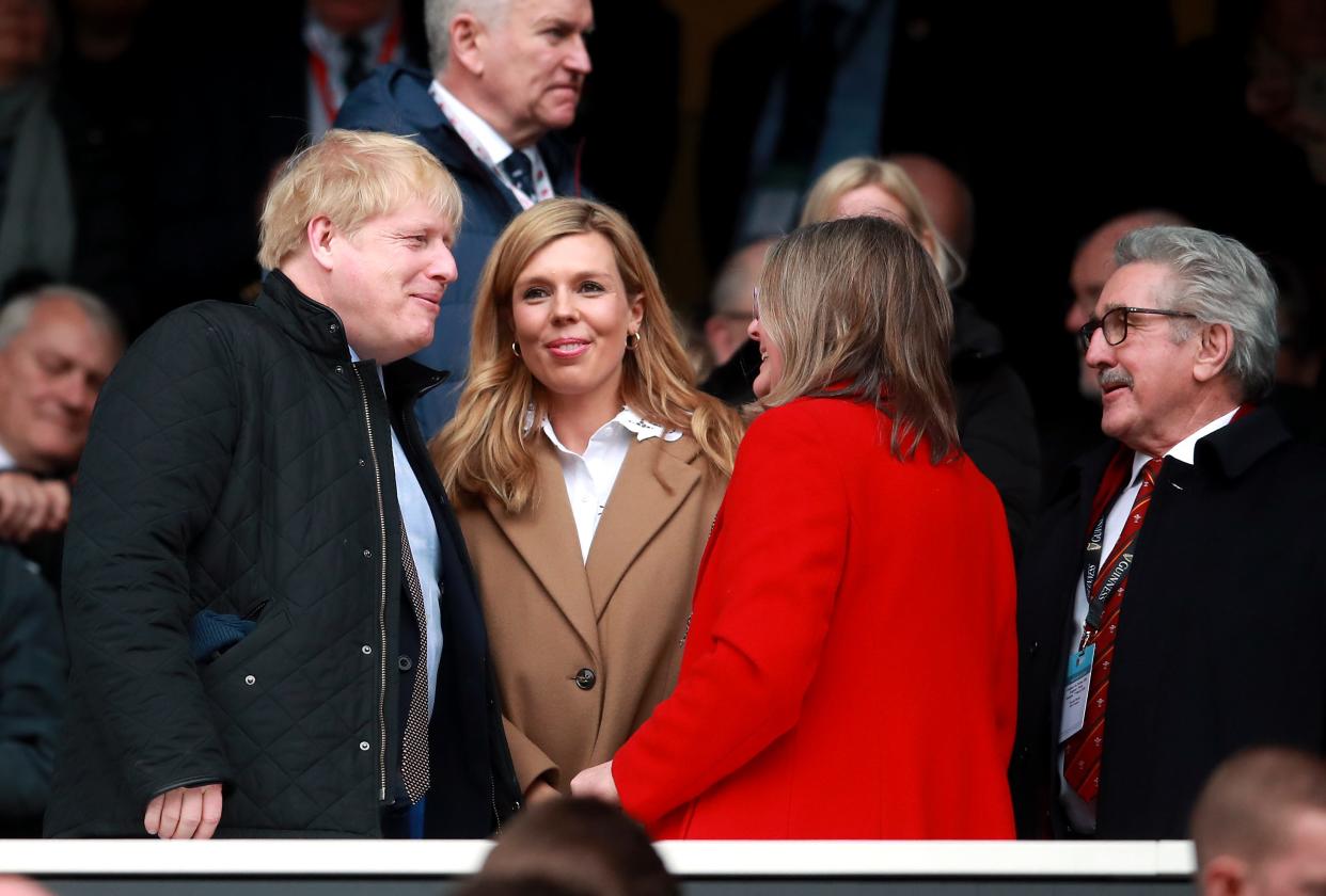 Prime Minister Boris Johnson and partner Carrie Symonds in the stands during the Guinness Six Nations match at Twickenham Stadium, London. (Photo by Adam Davy/PA Images via Getty Images)