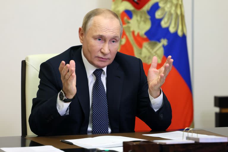 Russian President Vladimir Putin gestures during a meeting with the winners and finalists of the School Teacher of the Year national contest via videoconference at the Novo-Ogaryovo residence outside Moscow, Russia, Wednesday, Oct. 5, 2022. (Gavriil Grigorov, Sputnik, Kremlin Pool Photo via AP)