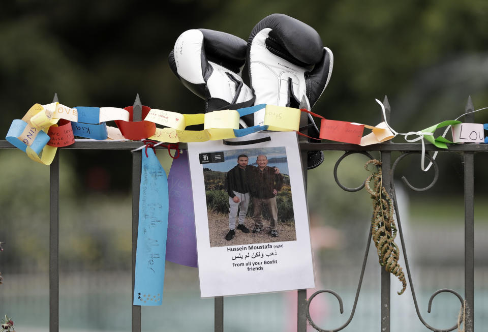 A tribute for mosque shooting victim Hossein Moustafa hangs on a wall at the Botanical Gardens in Christchurch, New Zealand, Thursday, March 21, 2019. Thousands of people were expected to come together for an emotional Friday prayer service led by the imam of one of the two New Zealand mosques where 50 worshippers were killed in a white supremacist attack on Friday March 15. (AP Photo/Mark Baker)