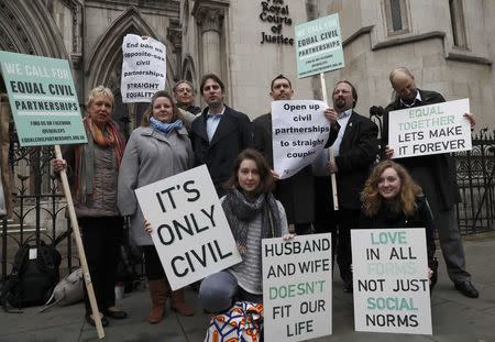 Rebecca Steinfeld (second row 2nd L) and Charles Keidan (second row 3rd L) pose for a photograph outside the Royal Courts of Justice in central London, Britain, February 21, 2017. REUTERS/Stefan Wermuth