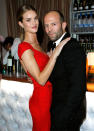 "Transformers" star Rosie Huntington-Whiteley snuggled up to her man, action hero Jason Statham, at the bar.