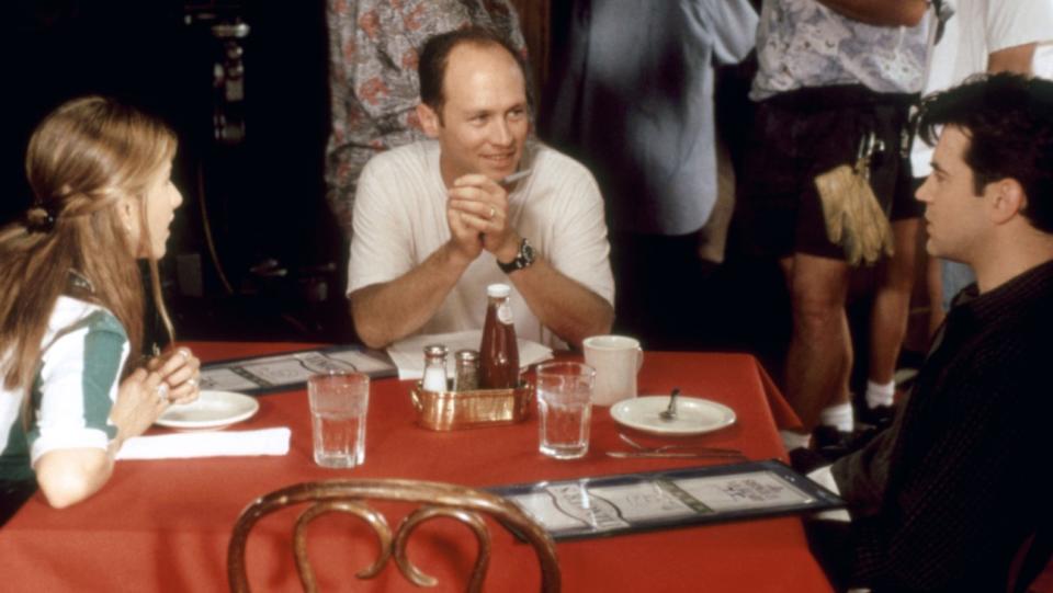 Jennifer Aniston, director Mike Judge and Ron Livingston on the 'Office Space' set