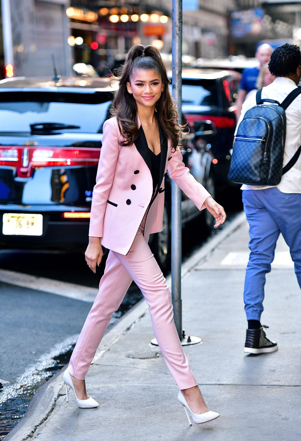 <p>The 21-year-old star was suited and booted in a fitted powder pink design. <i>[Photo: GC Images]</i> </p>