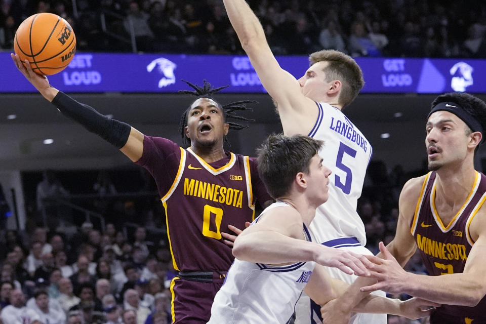 Minnesota guard Elijah Hawkins (0) drives to the basket against Northwestern guard Ryan Langborg (5) during the first half of an NCAA college basketball game in Evanston, Ill., Saturday, March 9, 2024. (AP Photo/Nam Y. Huh)