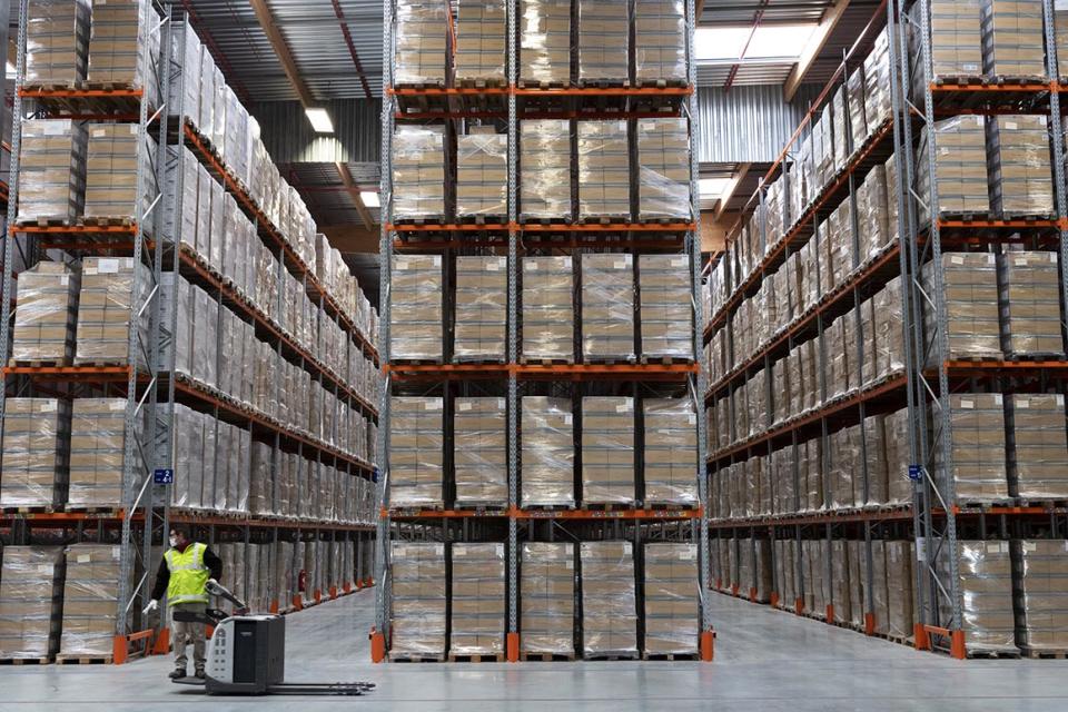 This photo provided by the French Army communication department (ECPAD) shows the stock of masks in the Marolles depot, eastern France, after the first delivery of mask s coming from China, Monday March 30 2020. The new coronavirus causes mild or moderate symptoms for most people, but for some, especially older adults and people with existing health problems, it can cause more severe illness or death. (Thomas Paudeleux/ECPAD via AP)