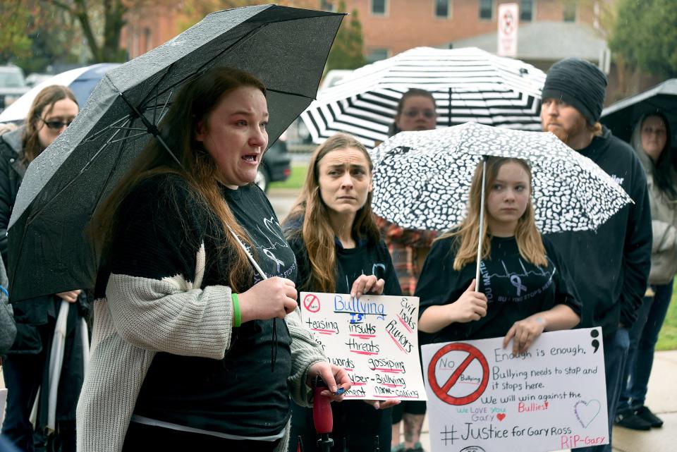 Melissa Stalnaker, close cousin to Gary Ross, cannot hold back the tears as she spoke Friday, April 28, 2023, at the "Justice for Gary" anti-bullying rally at Monroe Middle School. Gary Ross, 13, an eighth grader at Monroe Middle School, died by suicide April 19, 2023. At right is Juin Poineau with her daughter Mackenzea Coots, a seventh grader at the school.