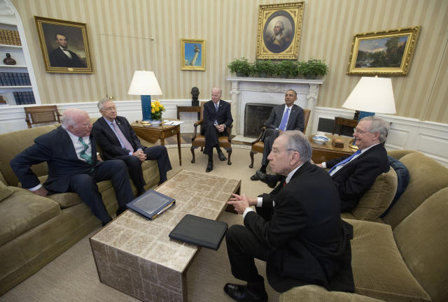 FILE - President Barack Obama meets with, from left, the Senate Judiciary Committee's ranking member Sen. Patrick Leahy, D-Vt., Senate Minority Leader Sen. Harry Reid of Nev., Vice President Joe Biden, the president, Senate Majority Leader Mitch McConnell of Ky., and Senate Judiciary Committee Chairman Sen. Chuck Grassley, R-Iowa, in the Oval Office of the White House in Washington, March 1, 2016, to discuss the vacancy in the Supreme Court. (AP Photo/Carolyn Kaster, File)