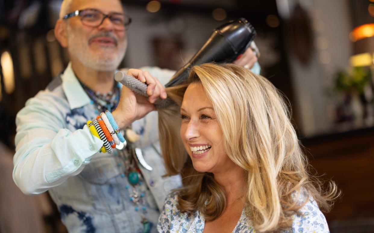 Lucia Ferrari getting her hair blow-dried and styled by Michael Charalambous at Nyumb