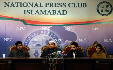 FILE PHOTO - Mufti Faisal Khushi speaks as Mesha Saeed (R), wife of missing social activist Waqass Goraya, Jibran Nasir (2ndR) a human rights lawyer and Faraz Haider (L), brother of missing social activist Salman Haider, listen during a news conference in Islamabad, Pakistan January 18, 2017. REUTERS/Caren Firouz/File Photo