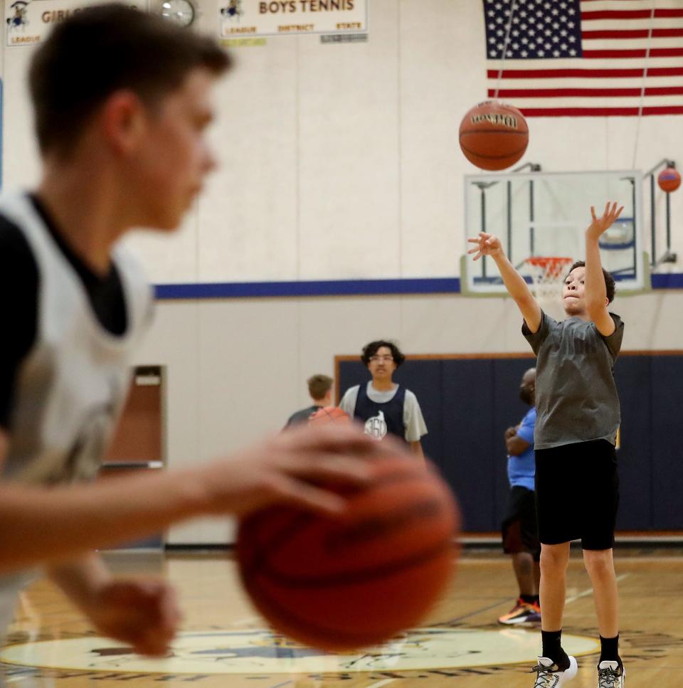 Commit360 basketball players warm up during practce at Bremerton High on Friday, July 1, 2022.