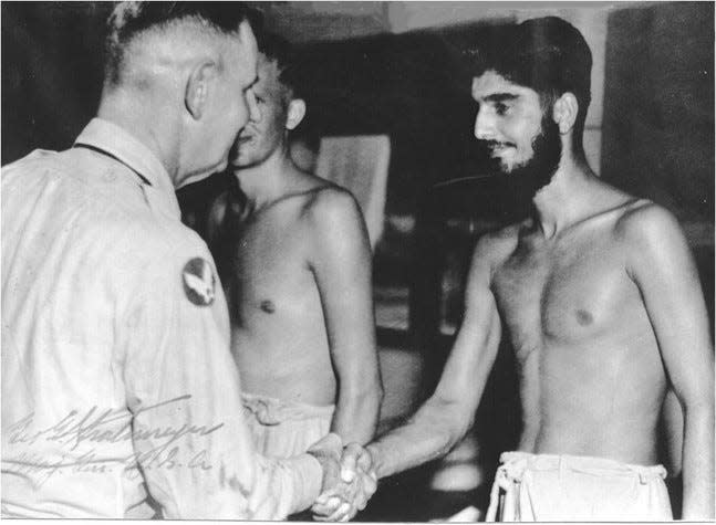 Karnig Thomasian greeted by then U.S. Major General George Stratmeyer, who later became commander of U.S. air forces in the China-Burma-India Theater, in May 1945 at a Calcutta, India hospital where Thomasian recovered after his release from a Japanese prison of war camp in Rangoon, Burma, in final months of WW 2.
