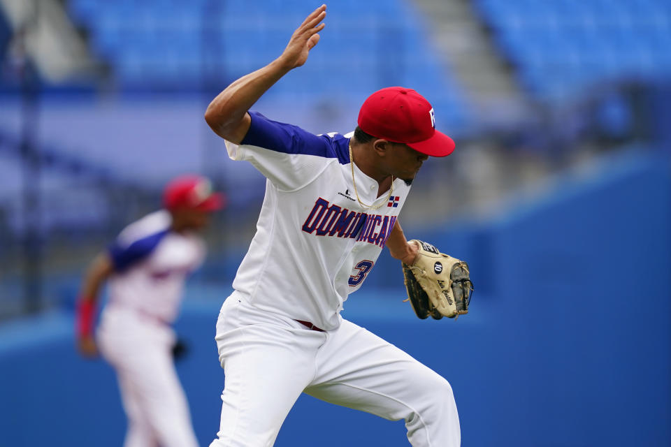 Dominican Republic's Luis Castillo rects after Dominican Republic won a baseball game against Mexico at Yokohama Baseball Stadium during the 2020 Summer Olympics, Friday, July 30, 2021, in Yokohama, Japan. (AP Photo/Matt Slocum)